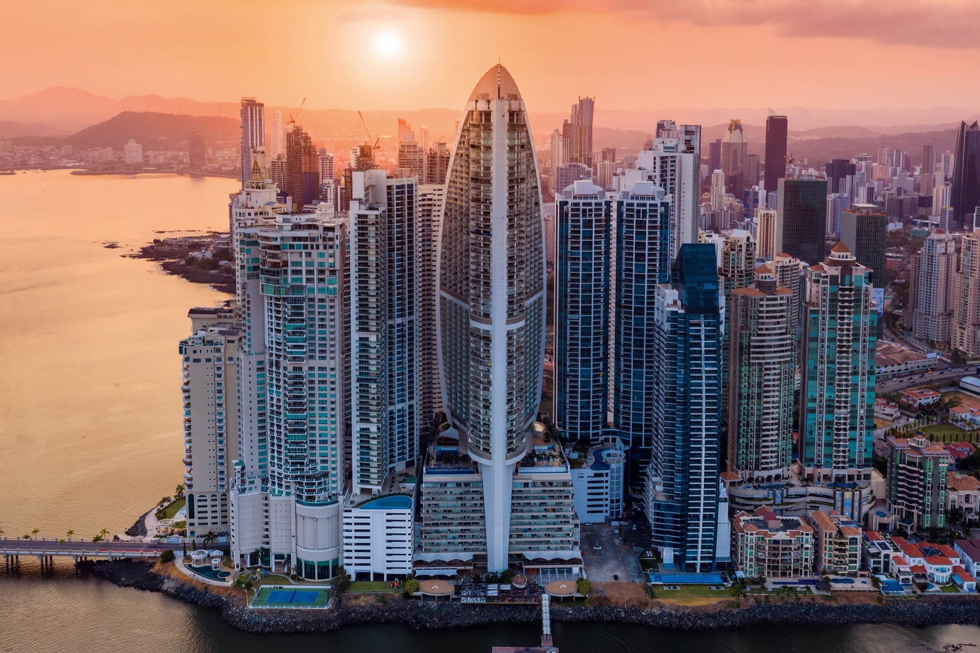 The towers of Punta Pacifica in Panama City at sunset, seen from the air
